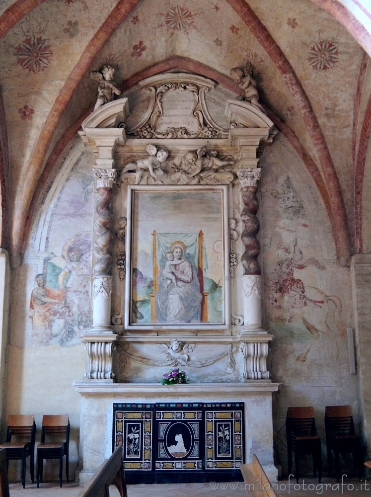 San Giuliano Milanese (Milan, Italy) - Madonna and Child on humble throne, between saints and horses in the Abbey of Viboldone